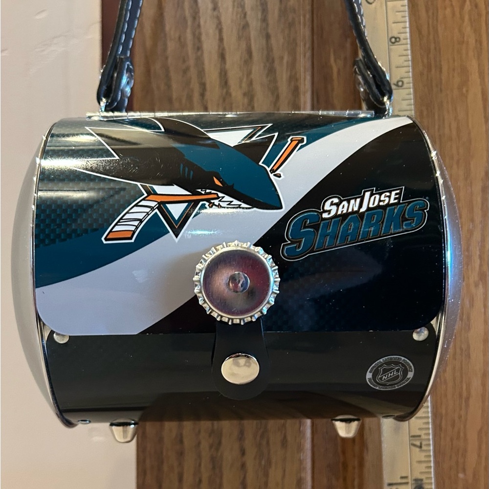 The NHL San Jose Sharks Metal Round Purse licensed by Little Earth Productions.